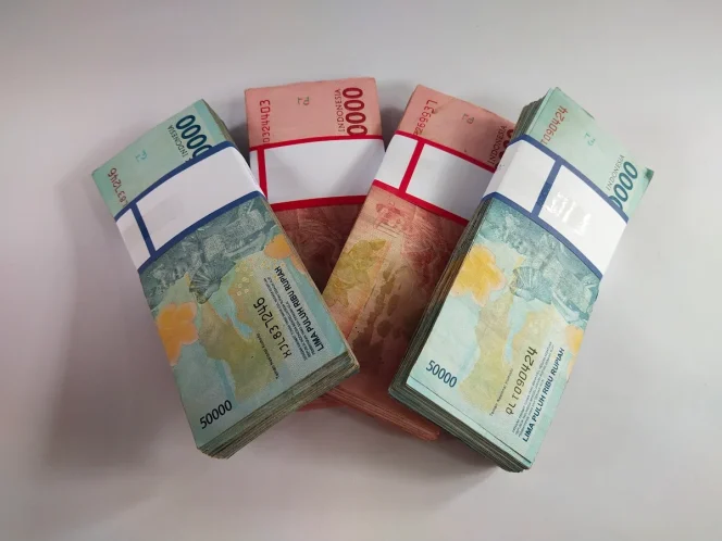 
					Uang rupiah. Foto Pegadaian.